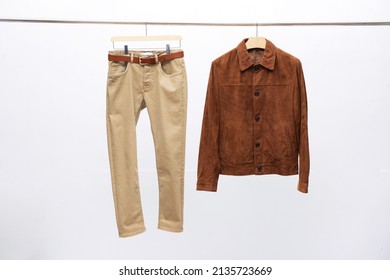 Brown Jacket ,shirt With Khaki Pants On Hanging

