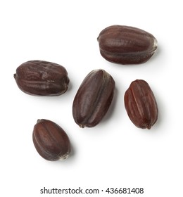 Brown Jojoba seeds on white background