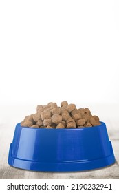 Brown Kibble Pieces For Cat Feed In A Bowl. Healthy Dry Pet Food