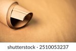 Brown kraft paper background and paper roll. Background with sheets of craft paper.