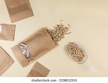 Brown kraft paper doypack bags with black-eyed peas on a yellow background. Packaging for foods and goods template mock-up. Packs with windows for weight products.Top view - Shutterstock ID 2238012555