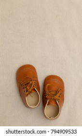Brown leather baby shoes - Shutterstock ID 794909533