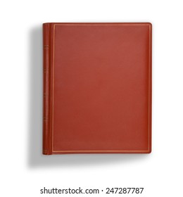Brown leather book cover on white with long shadow