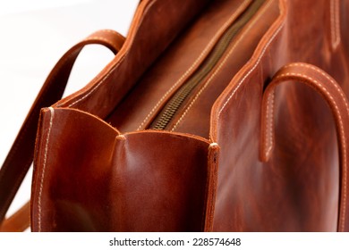 Brown leather boot or bag with zipper