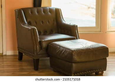 Brown Leather Chair And Ottoman