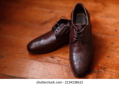 brown leather italian classic shoes close-up on wooden parquet - Powered by Shutterstock