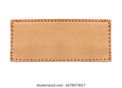 Brown leather label closeup. Rectangular patch isolated on white background. Jeans clothing leather detail. Fashion apparel blank leather badge for design. Closeup of stitched leather patch.