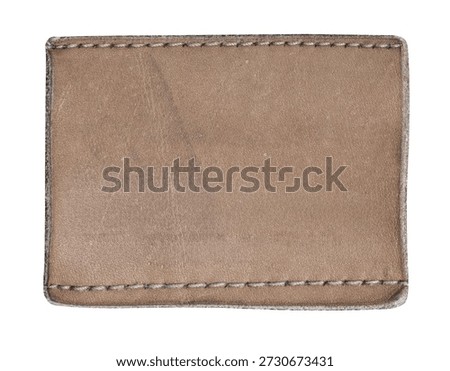 Brown leather patch with visible stitching, offering a customizable apparel label mockup