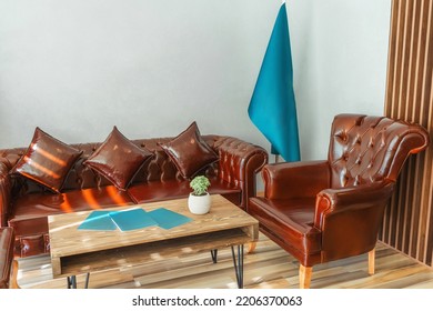 Brown Leather Sofa In Turkey Office. Place For Receiving Clients In The Office. Seating Area With Sofa