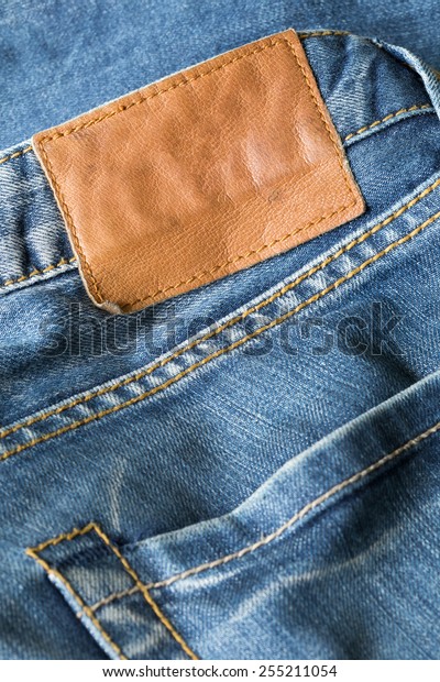 Brown Leather Tag On Blue Jeans Stock Photo (Edit Now) 255211054