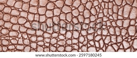 Brown leather texture background, closeup. Dark umber reptile skin, macro. Nature structure of textile. Luxury crocodile decorative backdrop.