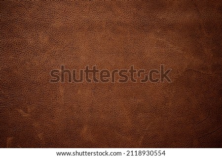 Brown leather texture background. Dark genuine leather