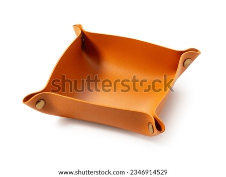 Brown leather tray placed on white background.