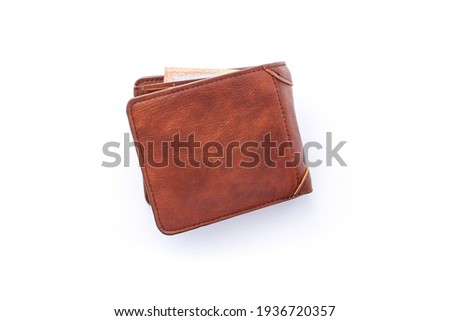 brown leather wallet with banknotes inside isolated on white background , top view , flat lay.