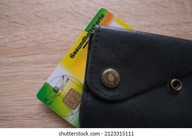 Brown Leather Wallet With Public Health Insurance Cheaper, Insurance Card In German, Concept Medical Support In Country And On Trip To Europe, Guarantee Of Treatment, Payments To Medical Fund