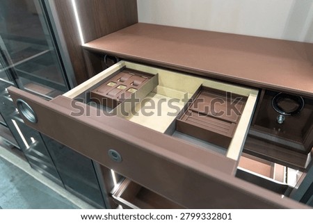 Brown leather wardrobe drawer with automatic watch winder unit