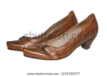 Brown leather women's shoes with heels on isolated background 