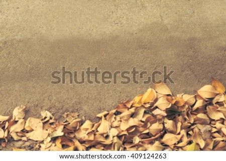 brown leaves on concrete floor blur style for background, have space for put text