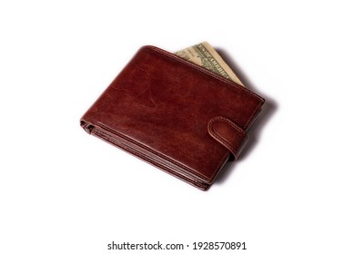 Brown male closed wallet with money on a white background. Close-up.