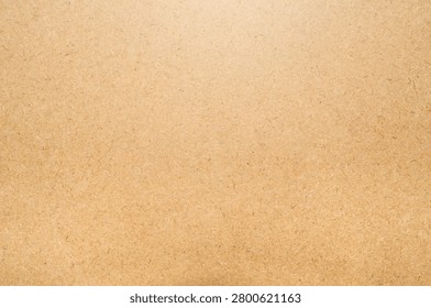Brown MDF Board Texture Background.
Flat lay close-up of a smooth brown MDF (Medium-Density Fibreboard) panel texture. This high-resolution wood fiber compressed board features fine organic particles and a clean, neutral surface, making it ideal for industrial design mockups, carpentry concepts, or minimalist rustic backgrounds.