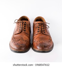 Brown Men's Brogues On A White Background Close-up. Classic Men's Shoes. Mockup