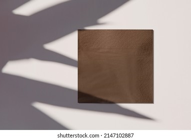 brown napkin with palm leaves shadows - Shutterstock ID 2147102887