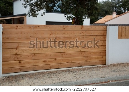brown natural wooden portal in wood of house gate garden access door