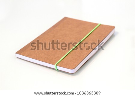 Brown Notebook on a White Background