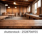 Brown old desk of empty space for your decoration. Blurred background of workshop in home interior. Natural sun light and mood. Mockup and space for your products.