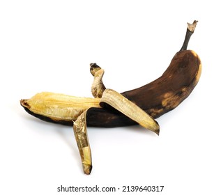 Brown overripe banana isolated on white background.