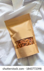 Brown Packaging Of Crunchy Golden Salty Snack
