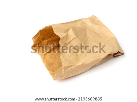 Brown paper bag isolated. Crumpled disposable ecology container, wrinkled paperbag, kraft paper bag on white background