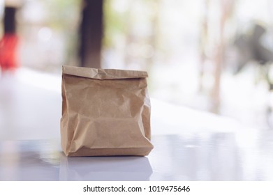 Brown Paper Bag For Pastry Placed On The Table.