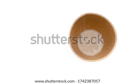 Brown paper cup for coffee, tea, a drink from environmental materials on a white background. A small cup in macro is on the right. Front view and top view, bottom visible. Place for text on the left