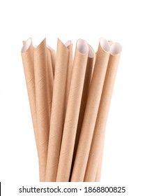 Brown paper drinking straws, isolated on white background. Eco-friendly paper straw, environmental consciousness concept. Close up.