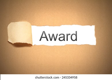 Brown Paper Envelope Torn To Reveal Award