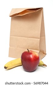 Brown Paper Lunch Bag With Red Apple And Banana On White Background