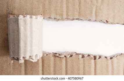 brown paper torn off revealing a white section.
