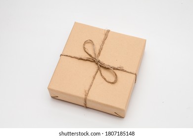 Brown Parcel Kraft Gift Box Present On White Background