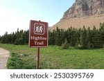 Brown park sign for Highline Trail. Hike here. Amazing views in Glacier National Park. From Logan Pass. Cross the Continental Divide. Ledge trail above the Garden Wall.