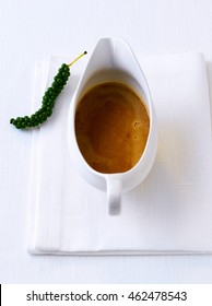 Brown Pepper Meat Sauce With Green Pepper Panicle In A Sauce Boat Isolated With Copy Space