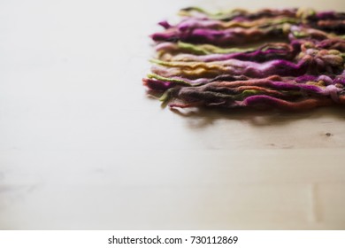 Brown, pink, yellow, orange and green threads.
