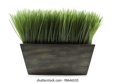 A Brown Planter Box With Green Grass