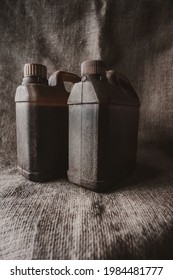 Brown Plastic Jerry Can On Brown Burlap