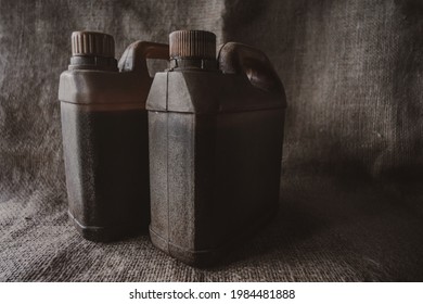 Brown Plastic Jerry Can On Brown Burlap