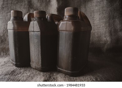 Brown Plastic Jerry Can On Brown Burlap