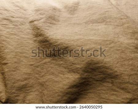 Brown polyamide fabric texture background with high contrast and sharp shadows