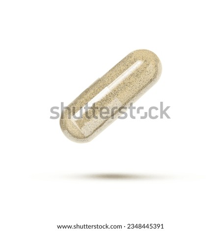 Brown powder herbal medicine capsule flying in the air isolated on white background. 