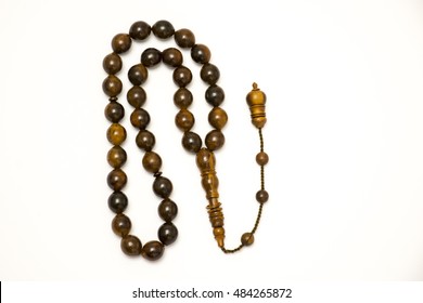 Brown prayer beads on white background