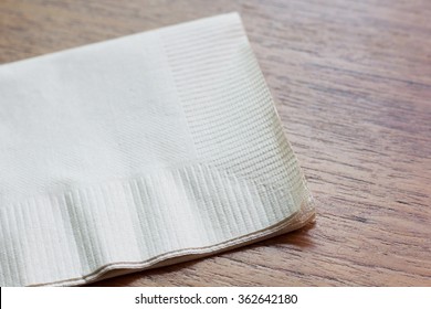 Brown Recycled Bar Napkin On The Wood Table